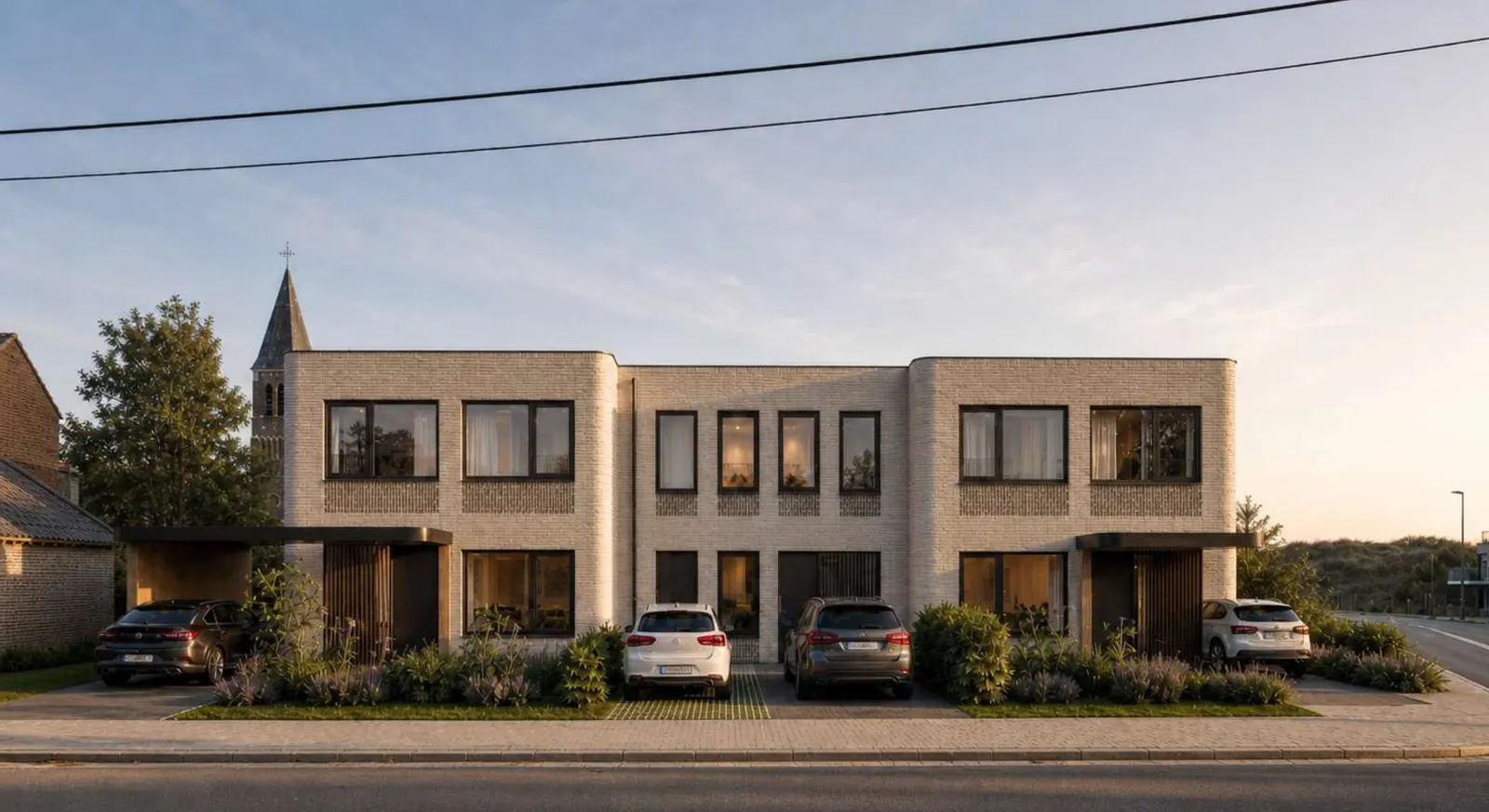 Ensemble de maisons mitoyennes en brique claire à toiture plate, avec carports et jardins de devant, face à la rue à Hautrage